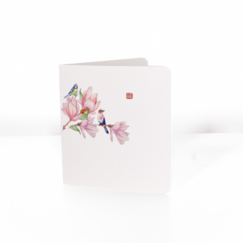 Greeting card from the Eastern Essence Collection: Melodies That Linger Letter, featuring a delicate watercolor design of pink magnolia flowers adorned with two colorful birds, symbolizing beauty and harmony. Perfect for celebrating special moments or sharing heartfelt sentiments.